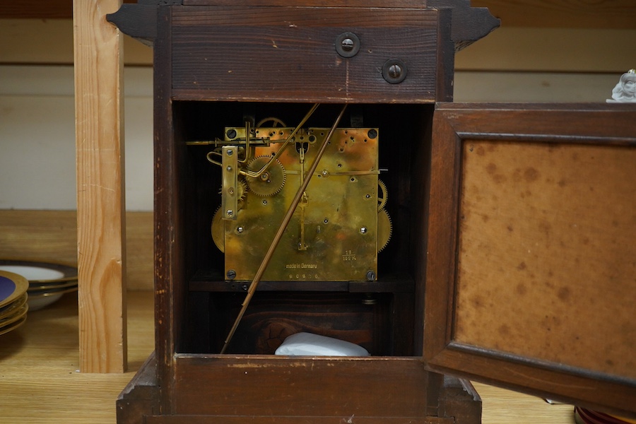 A late 19th century German oak three train mantel clock, 38.5cm high. Condition - fair, untested